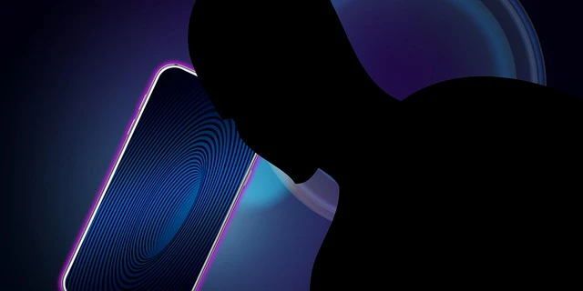 Silhouette of a person looking at a phone screen displaying a swirling pattern, symbolizing digital interaction or engagement